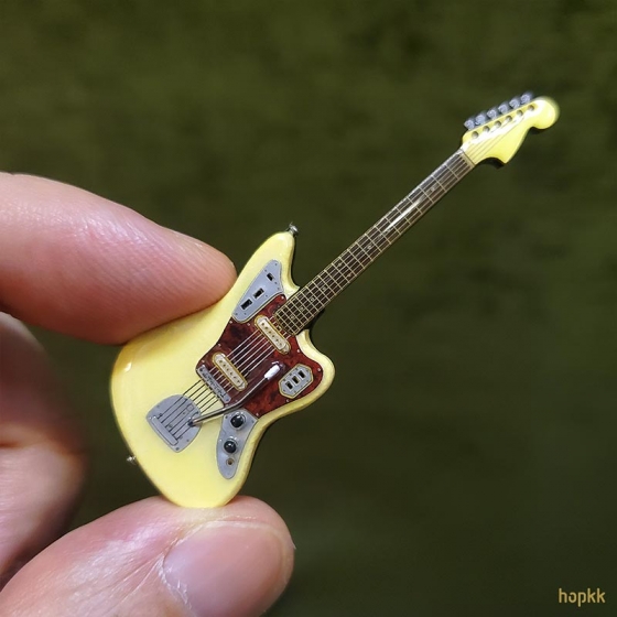 Miniature olympic white guitar lapel pin - Jaguar #0001 1
