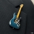 Miniature blue + black guitar lapel pin - Strat #0006